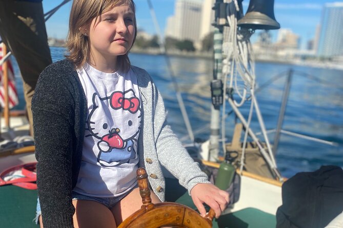 San Diego Sunset or Afternoon Sail on Classic Yacht - USS Midway under the bow: the naval scale shock from the bay