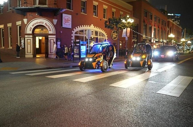 Viator Exclusive GoCar After Dark: Self-Guided Tour of Gaslamp and Balboa Park - USS Midway at night: ending on a big illuminated payoff